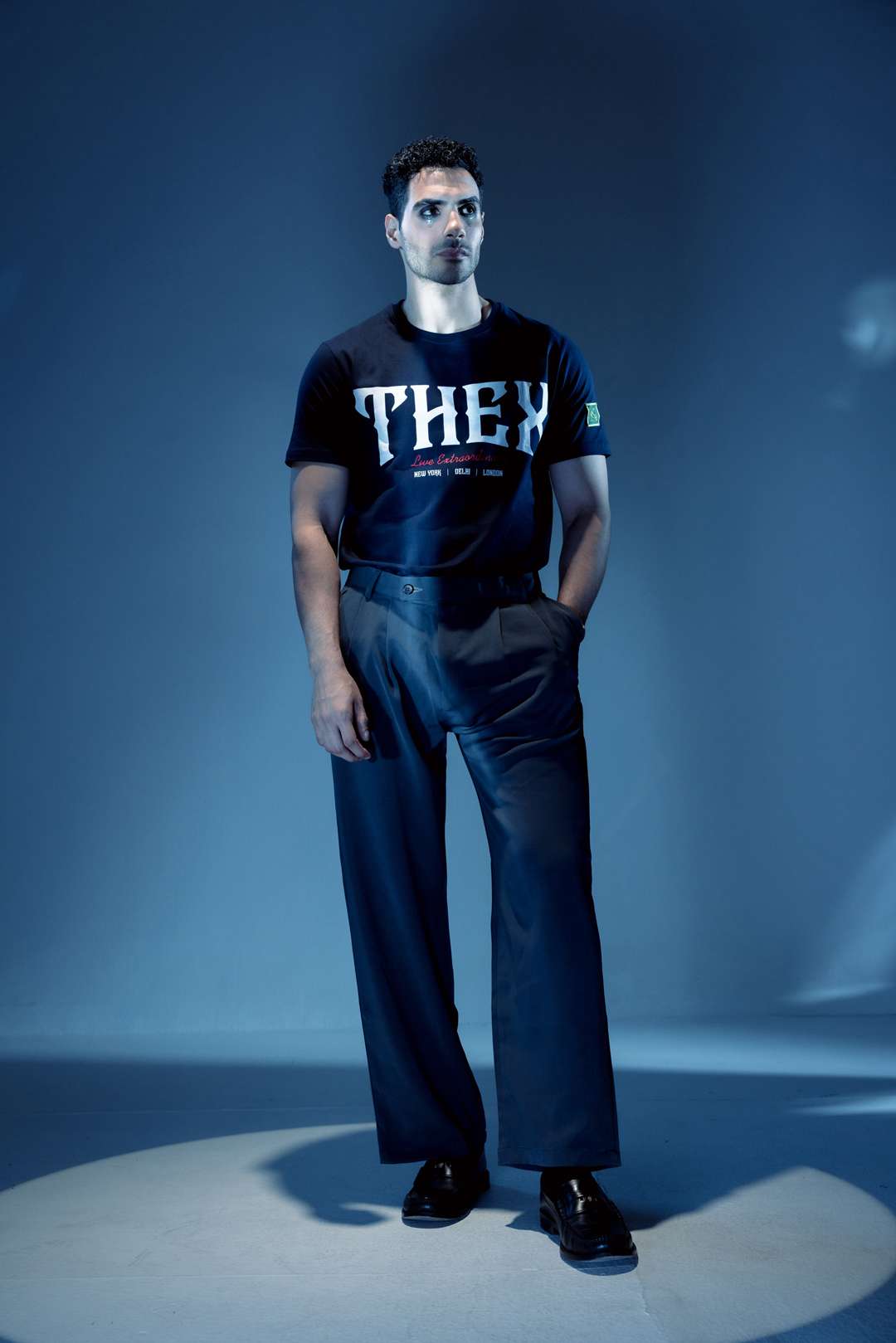 White Gothic Classic T-shirt: model wearing the navy T-shirt, full-length front view