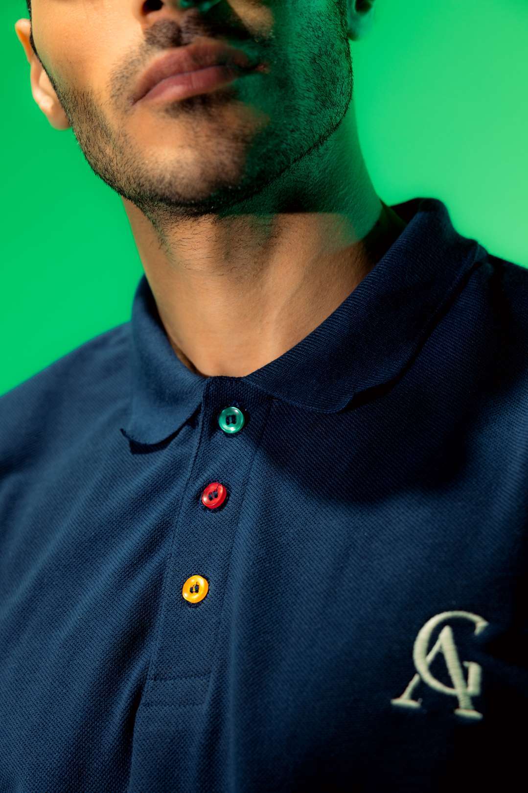 Evil Smile Lounge Polo (Unisex): close-up of the collar, buttons and AG chest monogram