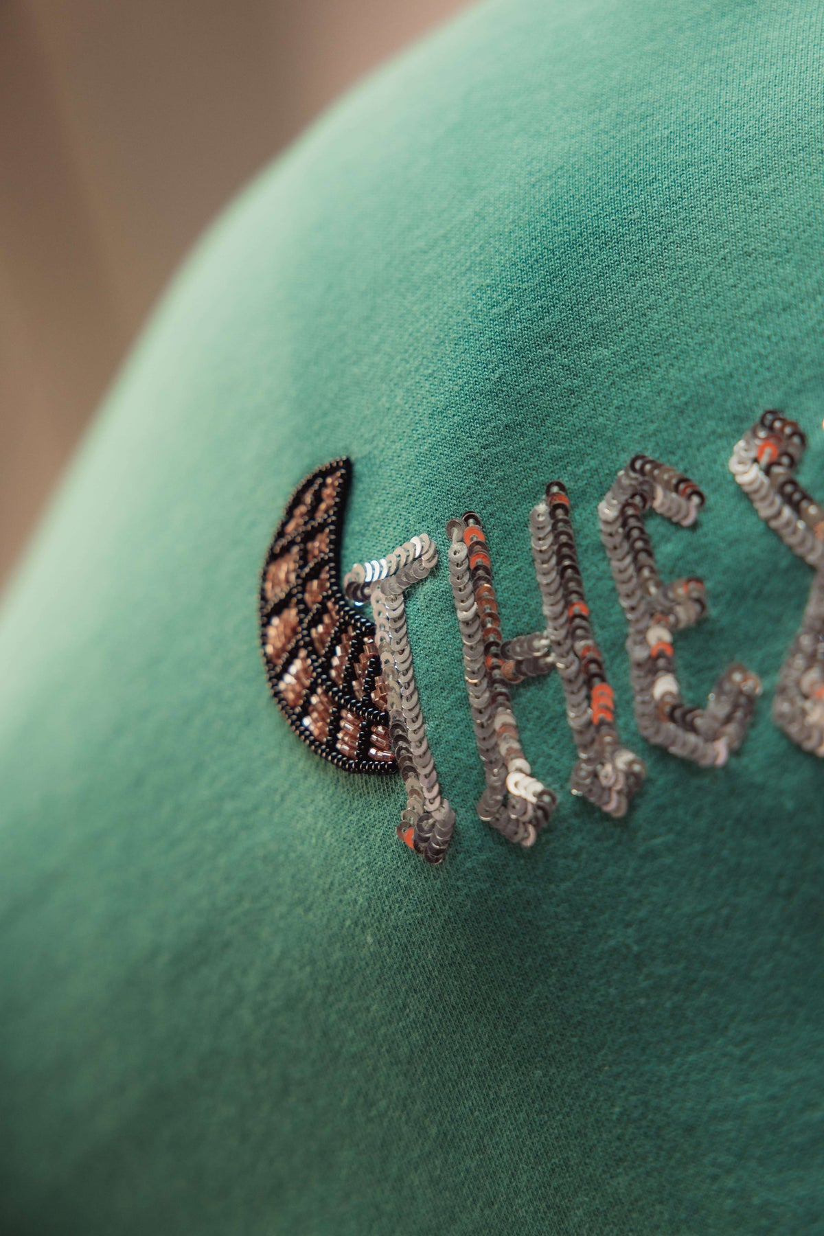 AG Shining Serpent (Unisex): close-up of the back lettering