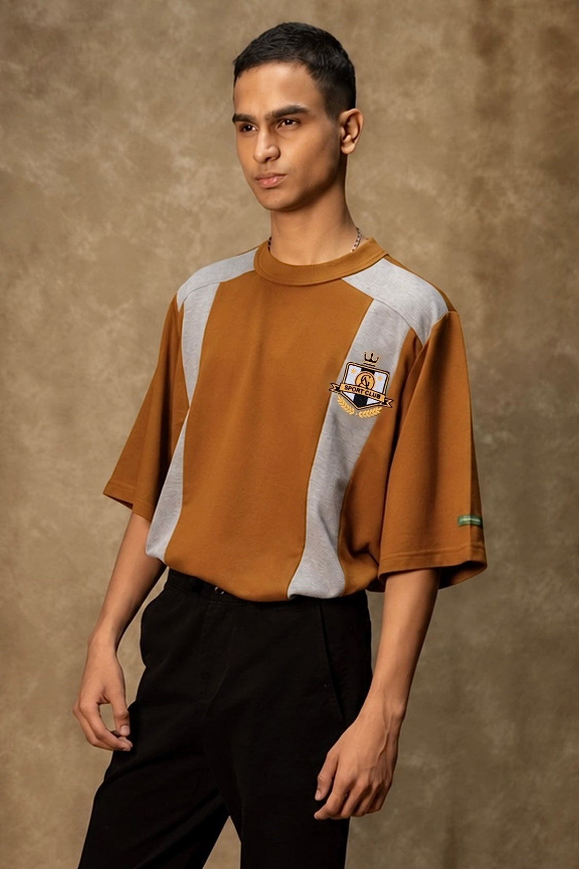 Chukker Charge Lounge T-shirt (Unisex): model wearing the brown T-shirt, front view