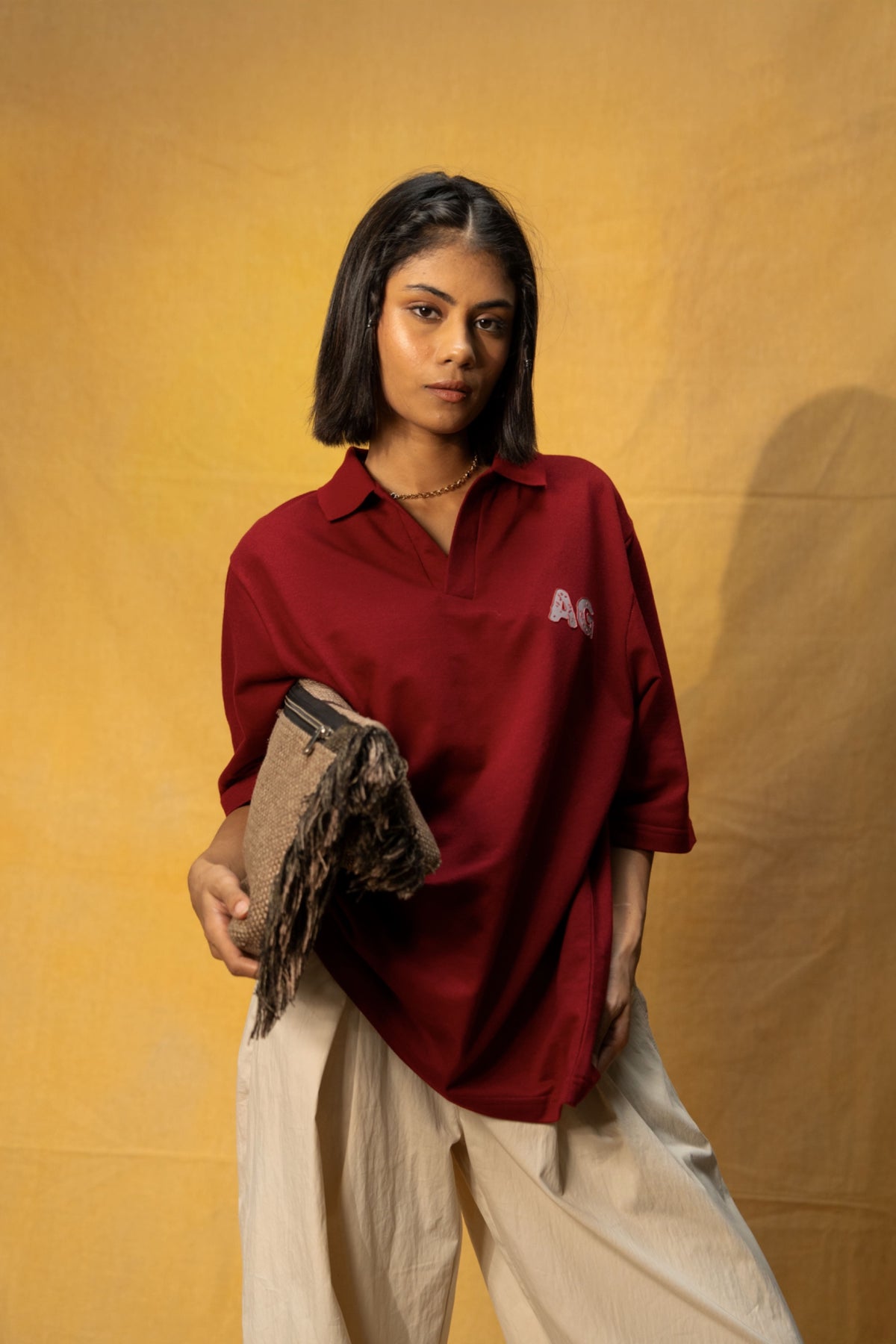 Just AG Lounge Polo (Unisex): model wearing the burgundy polo, angled front view