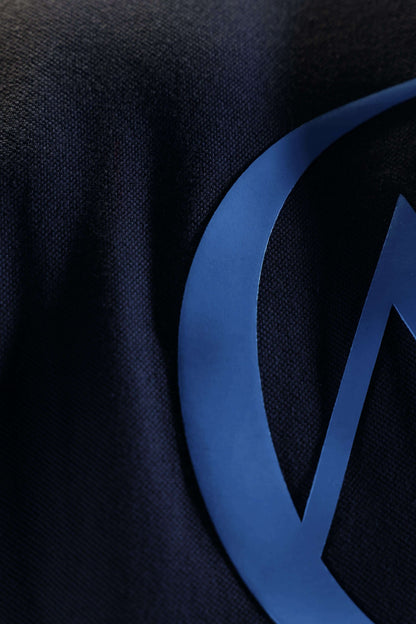 Ash Sky Classic Polo (Unisex): close-up of the blue AG back monogram