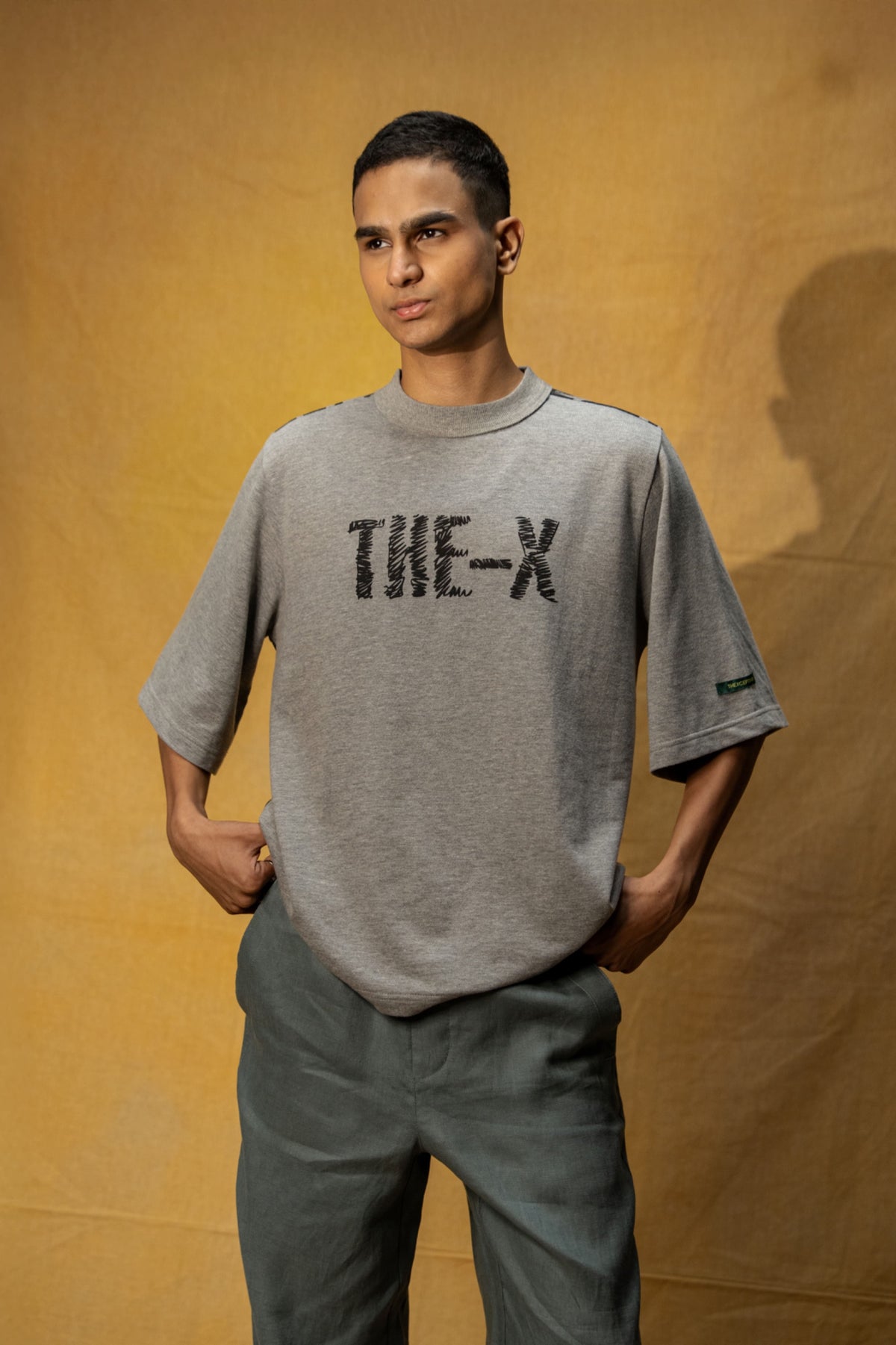 Soul Bound Lounge T-shirt (Unisex): model wearing the grey T-shirt, front view