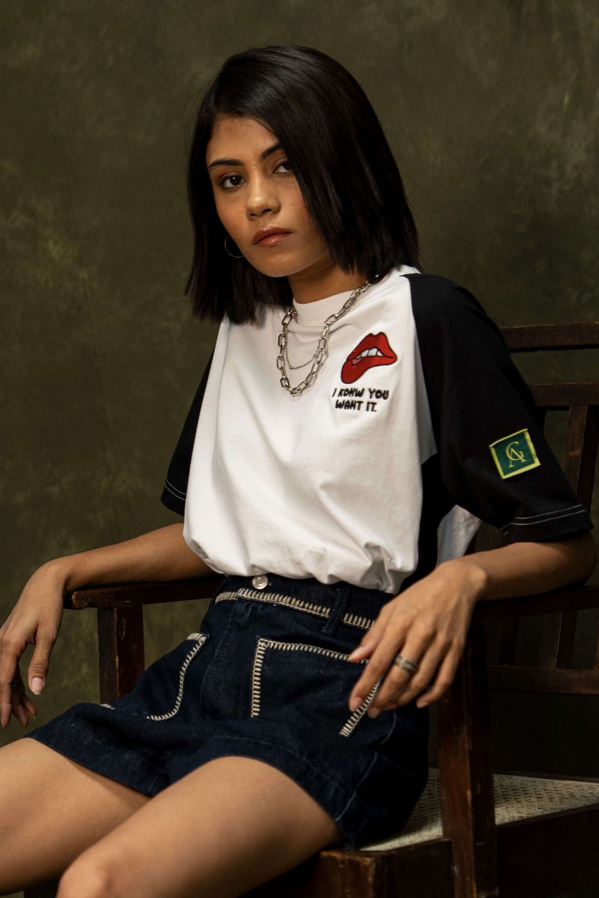 Tease Classic T-shirt (Unisex): model wearing the black-and-white T-shirt, angled front view