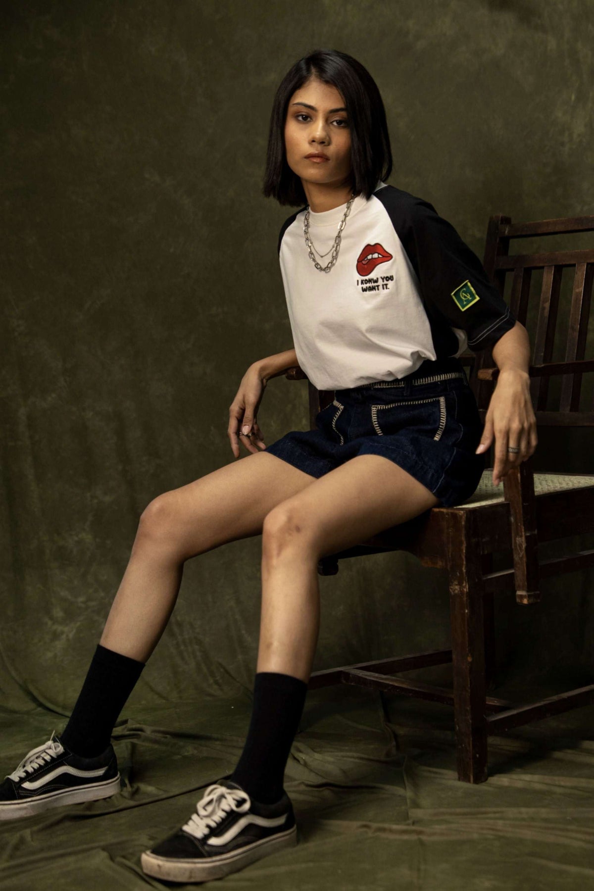 Tease Classic T-shirt (Unisex): model wearing the black-and-white T-shirt with shorts