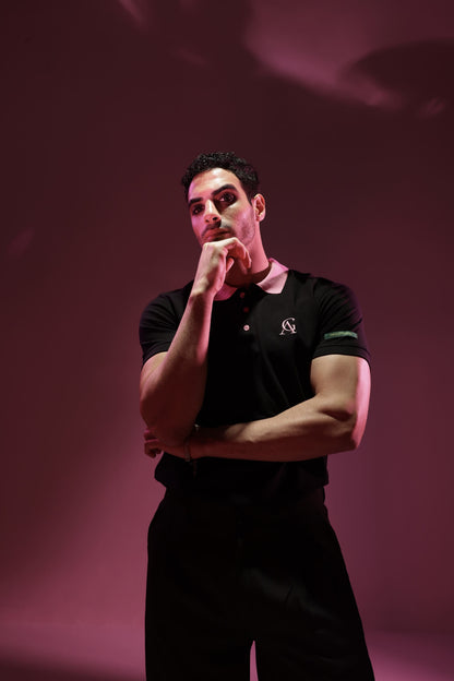 Pink Diamond Classic Polo: model wearing the black polo, front view