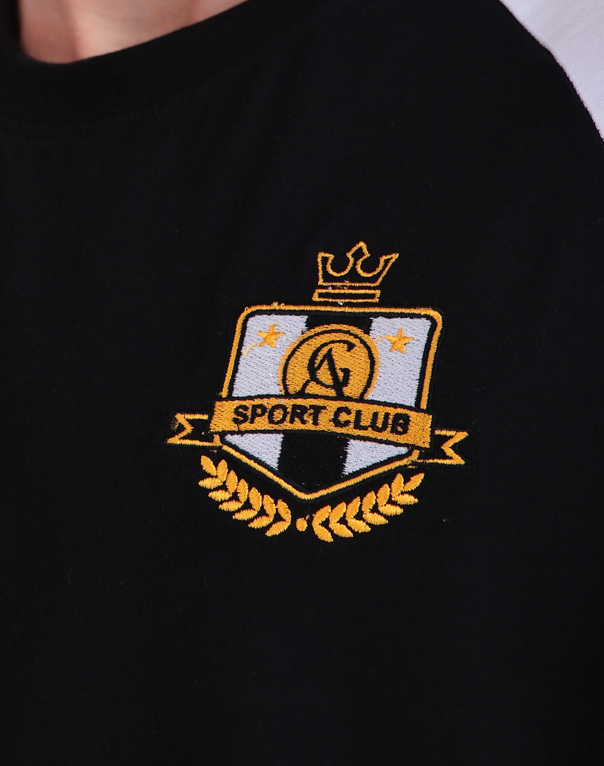Pickled Classic T-shirt (Unisex): close-up of the sport club chest crest